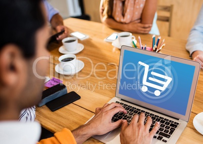 Person using Laptop with Shopping trolley icon