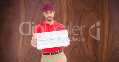 Confident delivery man giving pizza boxes