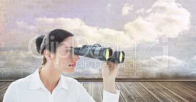 Digital composite image of businesswoman looking through binoculars