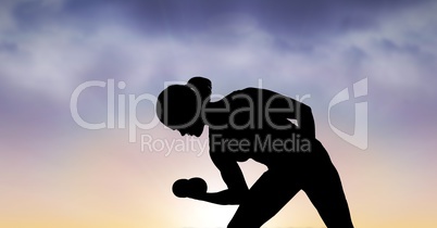 Silhouette woman exercising against sky