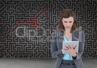 woman on tablet with maze background