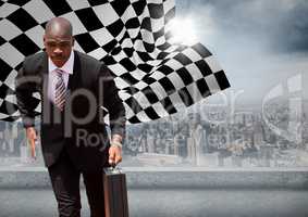 Business man running with briefcase against skyline with sun and checkered flag