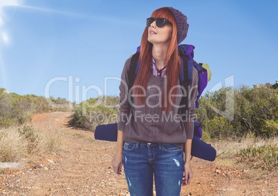 mountain travel,woman mountaineer with sun glasses in the road