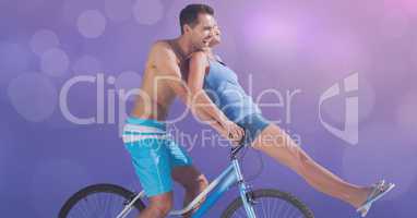 Happy couple riding bicycle during summer vacation