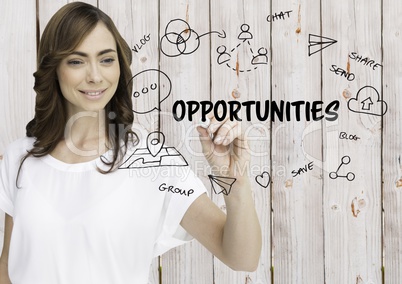 Opportunities graphic. Woman writing it. Wood background