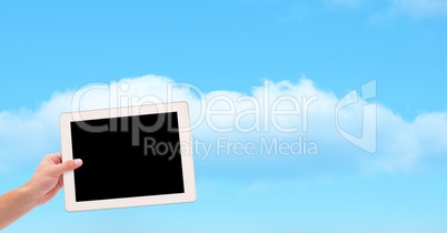 Hand holding device with blank screen against sky