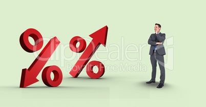 Digital composite image of businessman looking at percentage signs