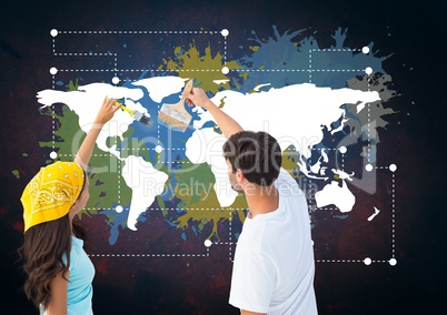 Couple painting a Colorful Map with paint splatters on wall background