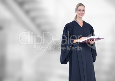 Judge holding book in front of bright staircase