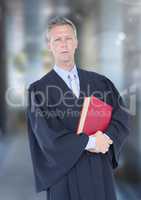 Judge holding book in front of street