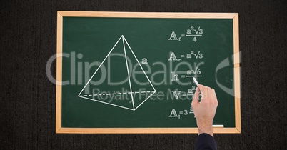Cropped image of hand writing match formulas on chalkboard