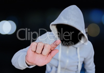 Anonymous Criminal Man in hood in front of city lights