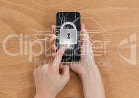 Overhead of hands with phone and white lock graphic with flare