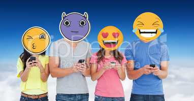 Digitally generated image of friends faces covered with emoji using smart phones against sky