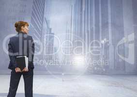 Businesswoman thinking in front of city street