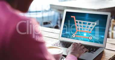 Cropped image of woman shopping online using laptop