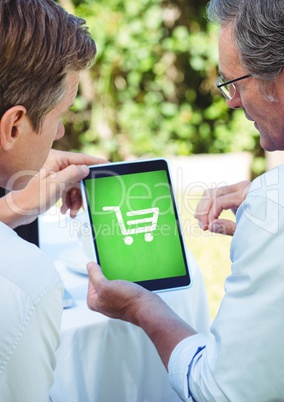 People using Tablet with Shopping trolley icon