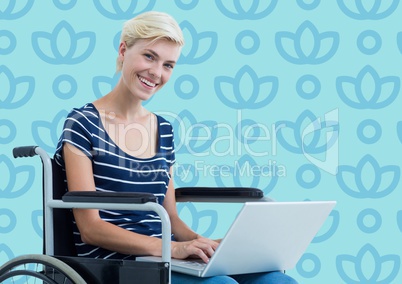Woman in wheelchair against blue floral pattern