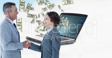 Business colleagues shaking hands with money in background