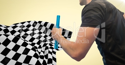 Relay runner mid section and flare against yellow background and checkered flag