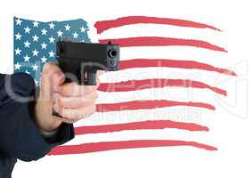 Hand holding gun with American flag