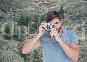 mountain travel, men teiking a photo in the mountains
