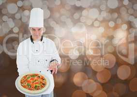 Chef showing the pizza. Lights background