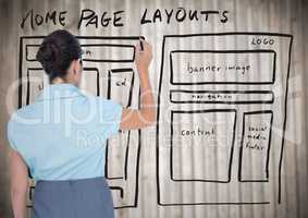 Woman with marker against website mock up and blurry wood panel