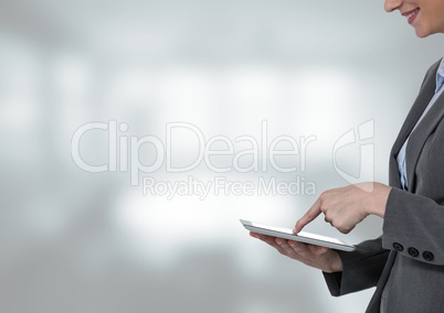 Woman touching tablet with bright background