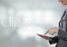Woman touching tablet with bright background