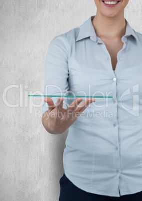 Midsection of smiling businesswoman holding transparent device