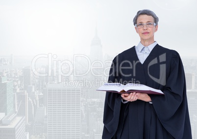 Judge holding book in front of bright city