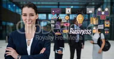 Happy businesswoman with arms crossed standing by business graphics