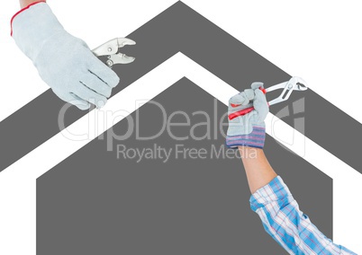 hands with tools on grey house background