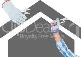 hands with tools on grey house background