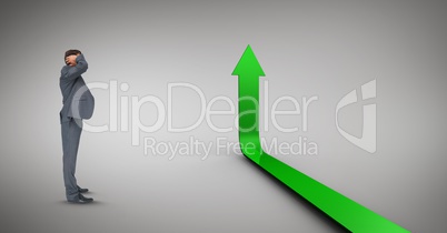Digital composite image of businessman with green arrow