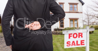 property seller with his fingers crossed