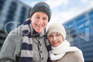 Portrait of happy senior couple in warm clothing