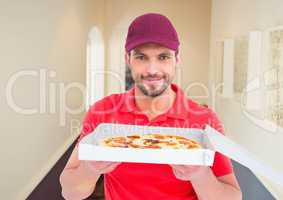 Deliveryman showing the pizza in the corridor of the house