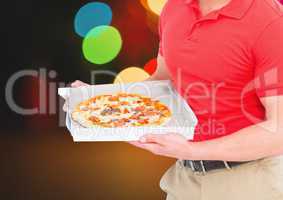 Deliveryman with pizza. Lights background