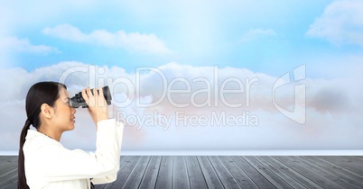 Digital composite image of businesswoman looking through binoculars on boardwalk