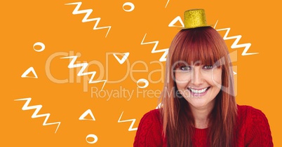 Woman in party hat against orange background with white patterns
