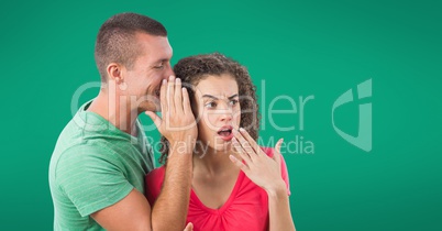 Whispering couple against green background