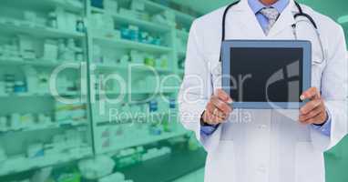 Composite image of doctor showing tablet