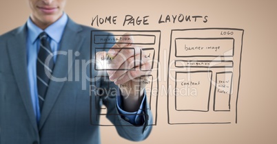 Business man mid section with marker and website mock up with flare against cream background