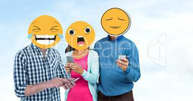 Friends with emojis over faces using smart phones