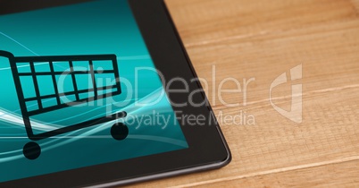 Shopping cart icons on digital tablet