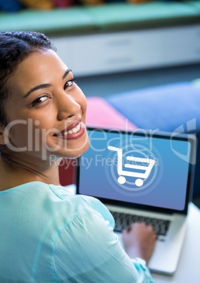 Woman using Laptop with Shopping trolley icon