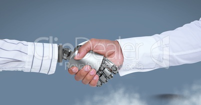 Android Robot hand shaking businessman hand with blue background
