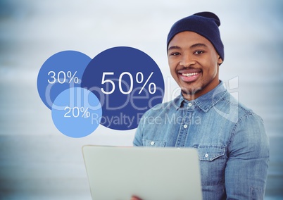 Woman with laptop and blue statistics against blurry blue wood panel